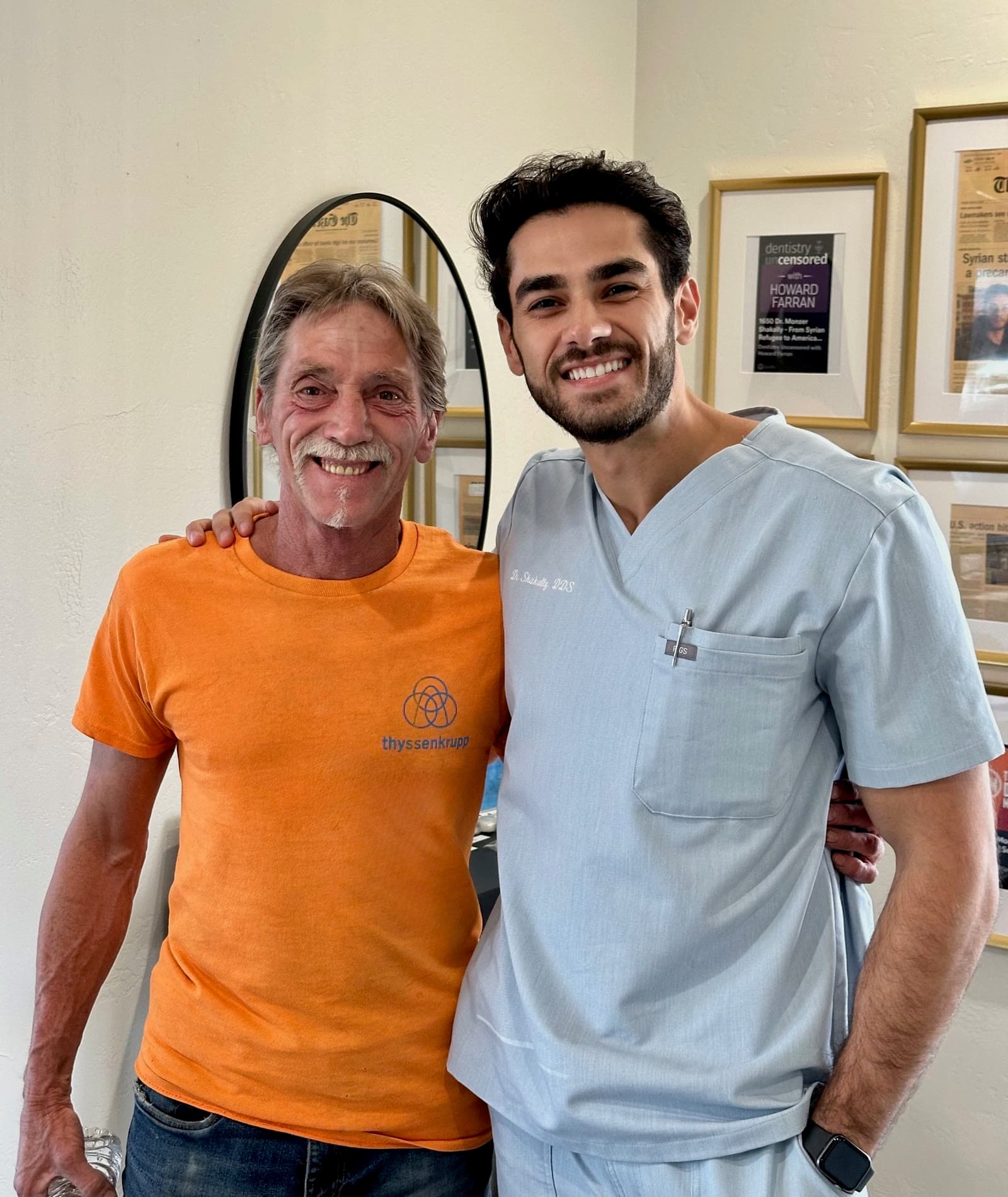 Dr. Monzer Shakally with a happy patient